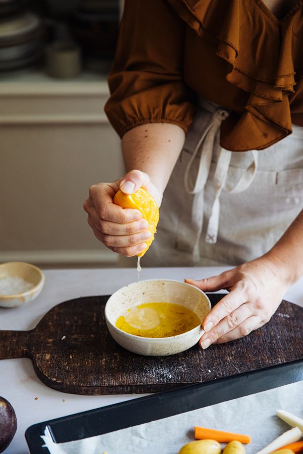 Juice of the orange squeezed into bowl.