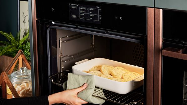 Transferring the French toast casserole to the oven to bake