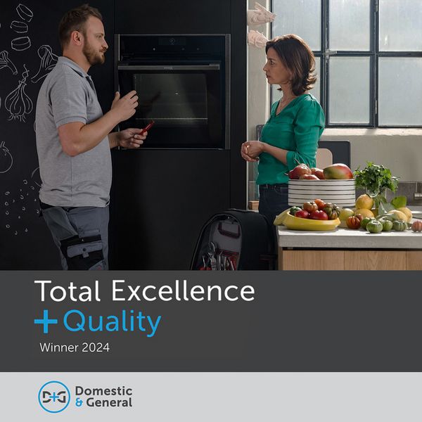 People stood talking next to NEFF oven with Domestic and General Total Excellence and Quality Award 2023 badge to side