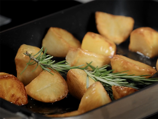 Roast potatoes in a dish