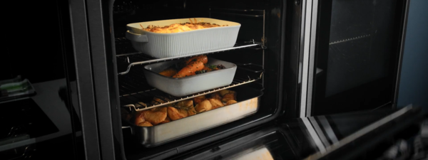 Multiple dishes in oven on different levels