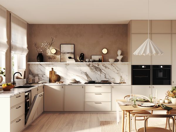 A contemporary kitchen featuring a dining table surrounded by chairs, showcasing a sleek and inviting design. 