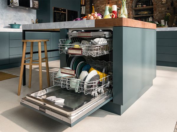 A modern kitchen featuring a sleek dishwasher and a stainless steel sink, showcasing a clean and organized space.