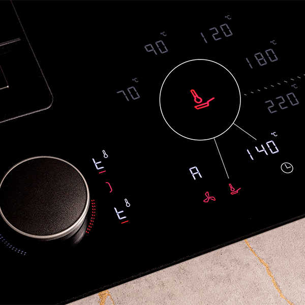 Close-up of a stove top control panel featuring a frying sensor for precise cooking temperature management.