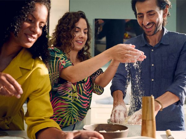 People cooking together in kitchen