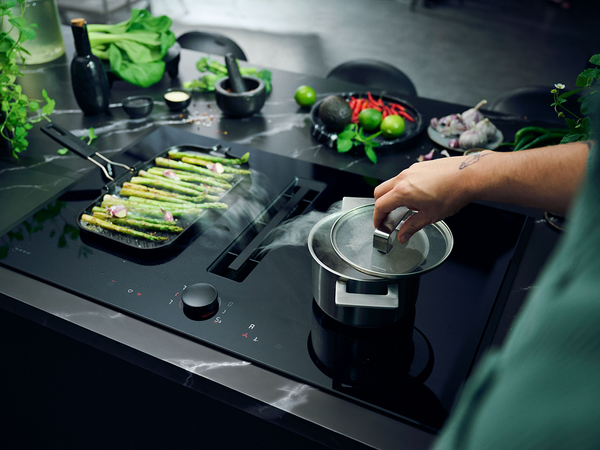 NEFF Venting Hob extracting steam from food being cooked