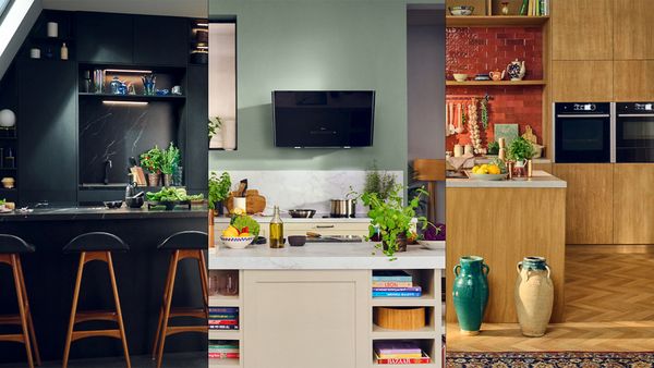 A modern kitchen featuring a large island, a bar area, and a stove, showcasing a spacious and functional design. 