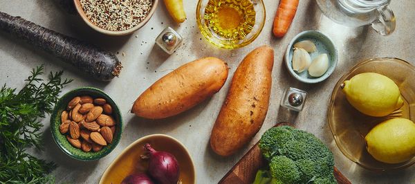 A pizza with a golden crust and melted cheese, baking on a tray inside an oven, ready to be enjoyed.