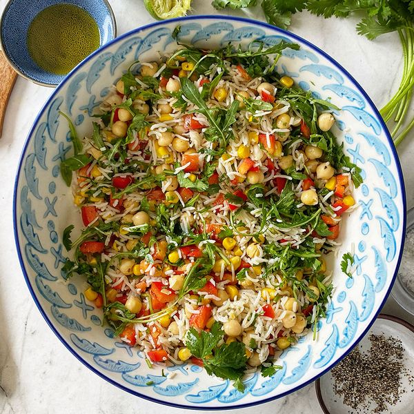 Chickpea rice and rocket salad in a large serving bowl