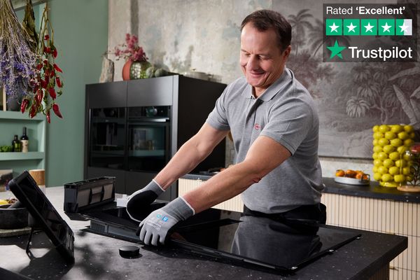 Engineer repairing a NEFF hob.