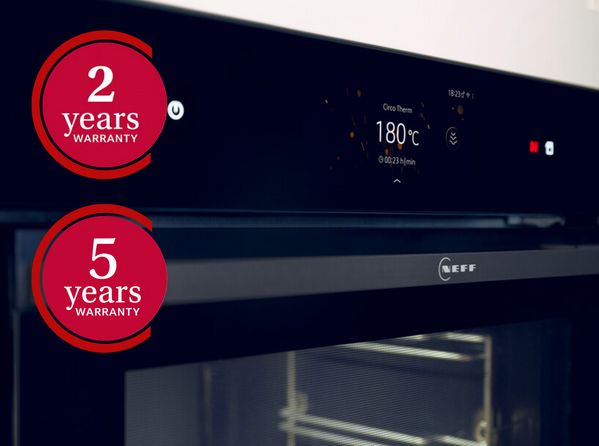 Close up of oven panel with two and five year warranty icons