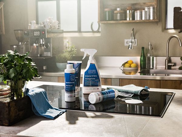 NEFF cleaning and care accessories displayed on a hob 