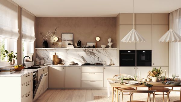 A contemporary kitchen showcasing stylish fixtures and a bright, colorful wall accent.