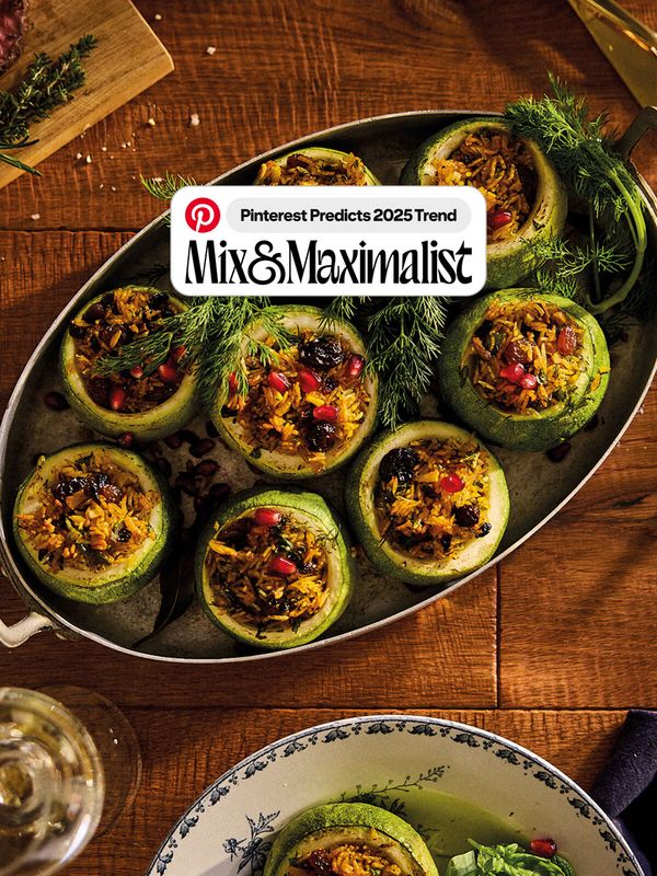 A dark coloured table with a few ingredients like nettle, two eggs, butter, red onions, cheese or lemons