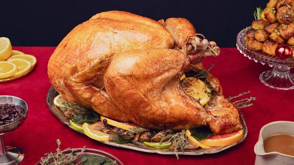 Lemon and thyme turkey centrepiece on a table