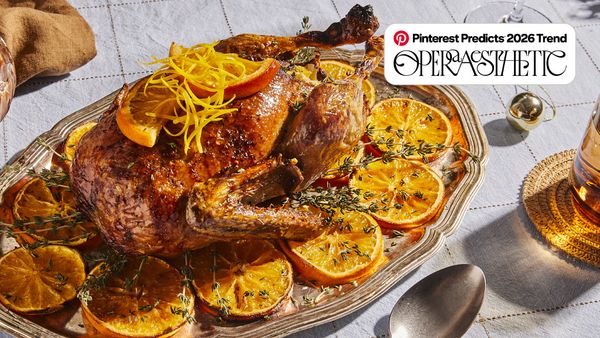 Chicken cooked with orange on a platter on table