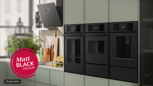 Moderne salbeigr&uuml;ne K&uuml;che mit mattschwarzen NEFF Einbauger&auml;ten, darunter Backofen, Kompaktbackofen, Kaffeevollautomat, Induktionskochfeld und Dunstabzugshaube.