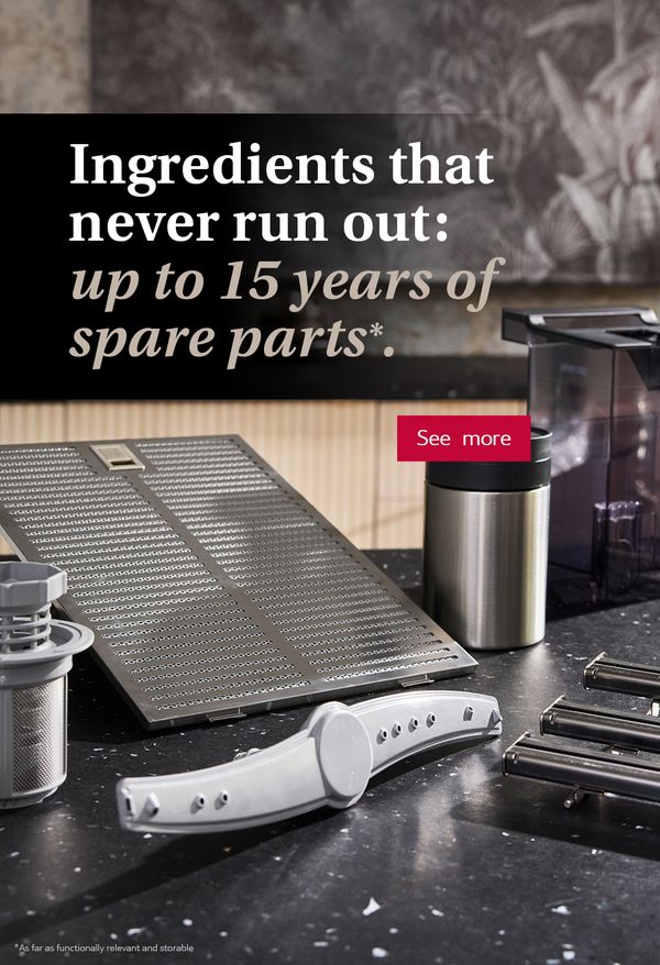 Modern black kitchen interior with multiple spare parts on countertop