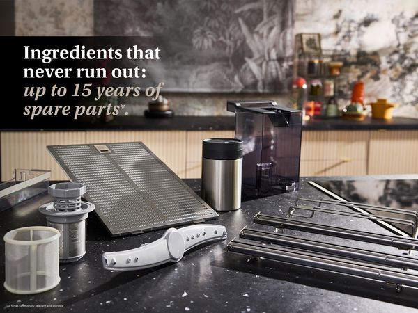 Modern black kitchen interior with multiple spare parts on countertop