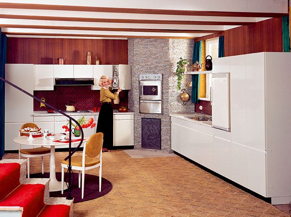 Lady in old fashioned kitchen with NEFF built-in appliances
