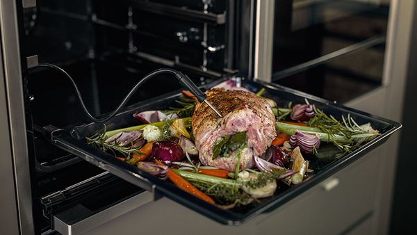 NEFF Single Oven showing ComfortFlex Rails in use and Meat Probe to roast lamb