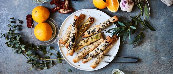 Pastry cigars with orange carrot dip