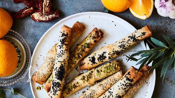 Pastry cigars with orange carrot dip