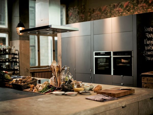 NEFF Ceiling Hood and built-in ovens in modern kitchen