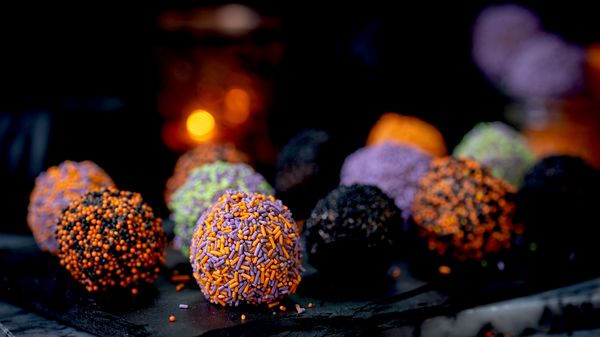 Finished Halloween chocolate truffles in different coloured sprinkles