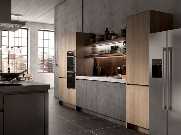 Section of wood and slate styled kitchen with NEFF built-in appliances