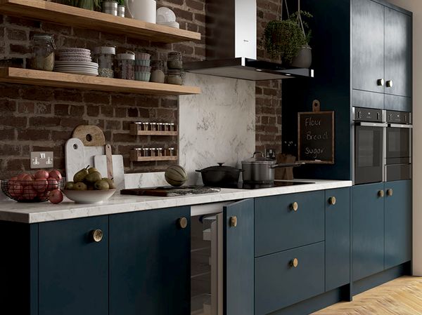 Brick and blue styled kitchen with NEFF built-in fridge door open