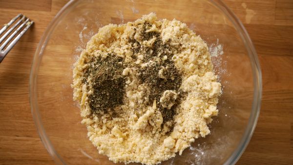 Adding herbs to the butter and flour breadcrumbs mix