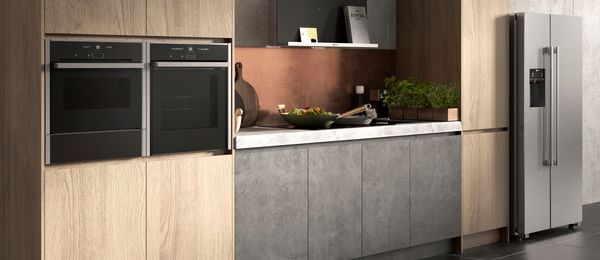 Wood and slate style kitchen featuring NEFF N 70 built-in appliances